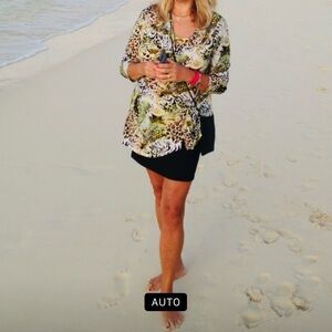 Animal print top; rouched on the side: size L